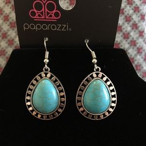 blue pair of earrings